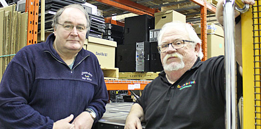 Keith Grill (l) and Crawford McKee at the Computers for Schools workshop in Regina.